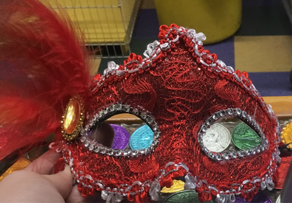 ASSORTED COLOR BRAIDED GLITTER MASK WITH FEATHER